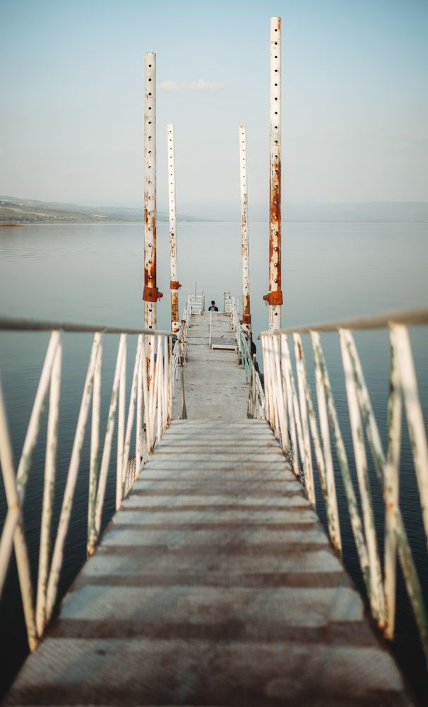 Rusty pier near calm sea