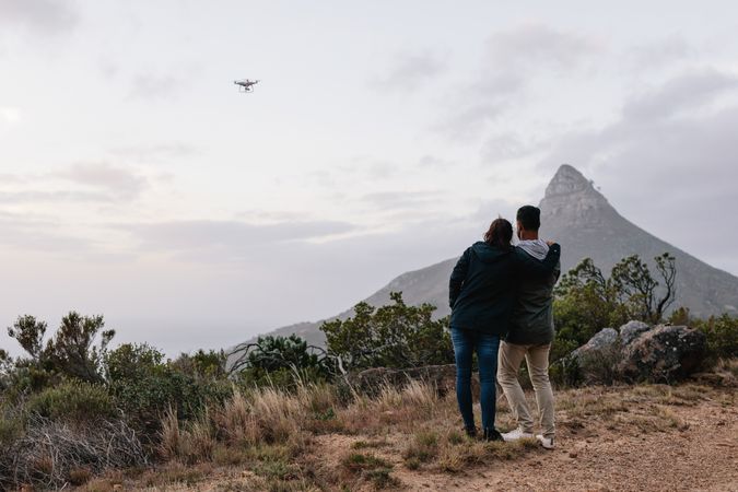 A couple taking drone shots in nature