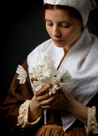 Medieval maid holding flowers