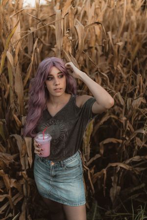 Casual woman in dry vegetation