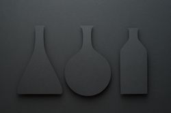 Paper cut outs of chemistry beakers