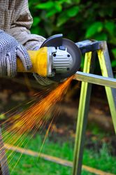 Person welding metallic rods