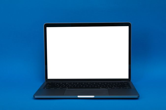 Blue room with laptop with mockup screen