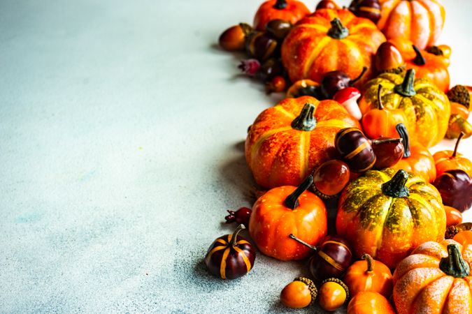 Pumpkin ornaments on light table with copy space