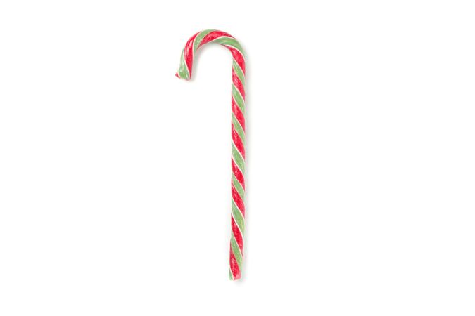 Sweet candy cane isolated on studio background