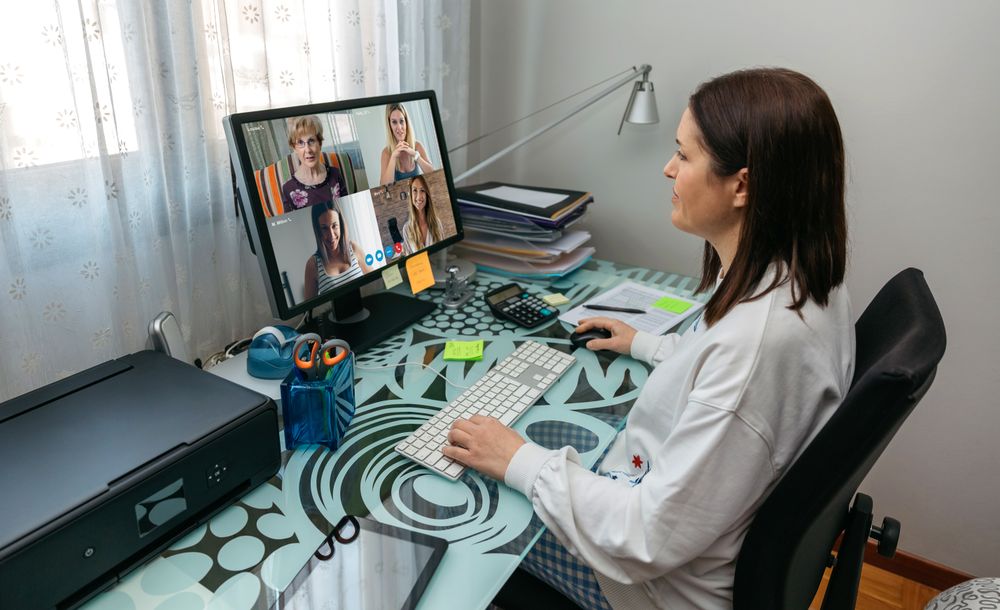 Woman talking on video call with friends