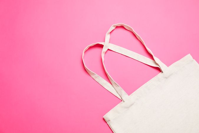 Eco bag on color background, space for text
