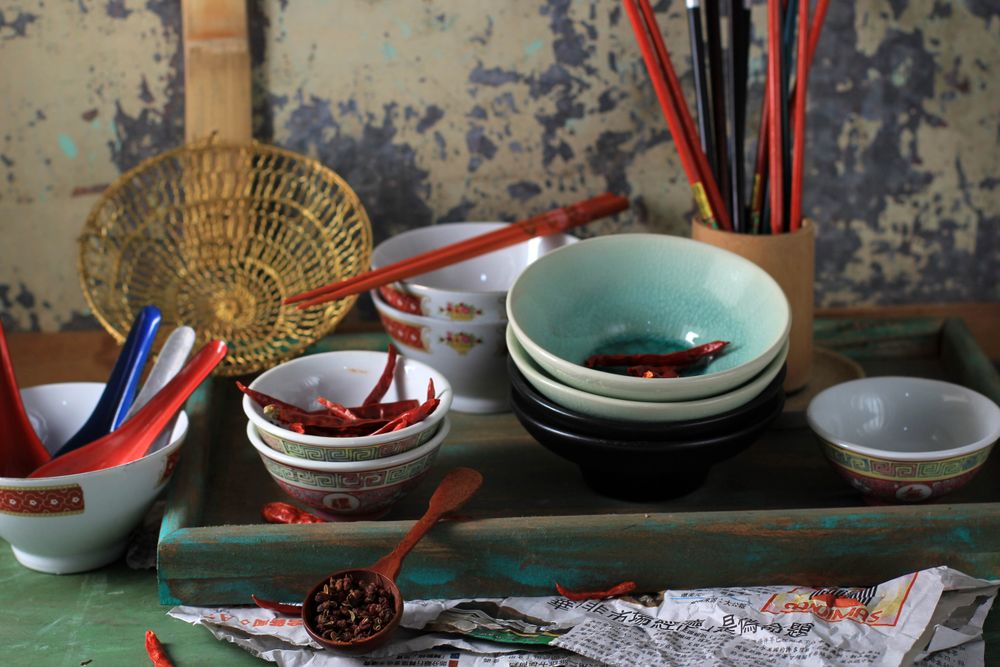 Bowls and Spoon with Rustic Background and Sun Dried Chilli