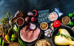 Pork & turkey surrounded by ingredients for dinner