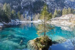 Tranquil blue lake in snowy mountains