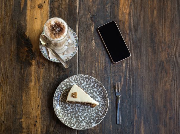 Woman eating cake in restaurant