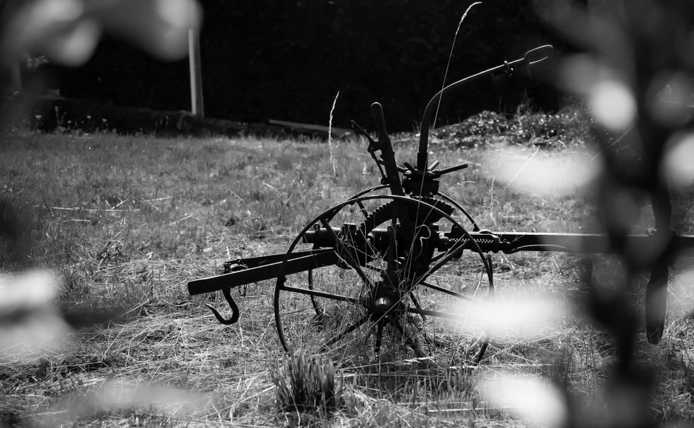 Old farming equipment in field
