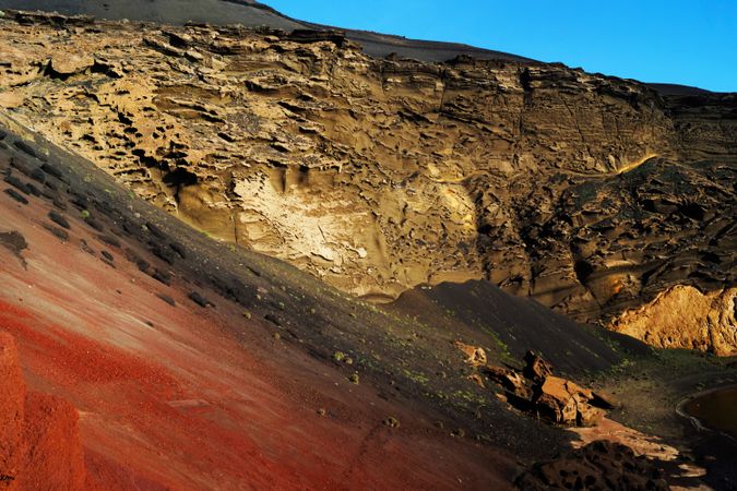 Picturesque view of volcanic terrain with solidified lava in wild area