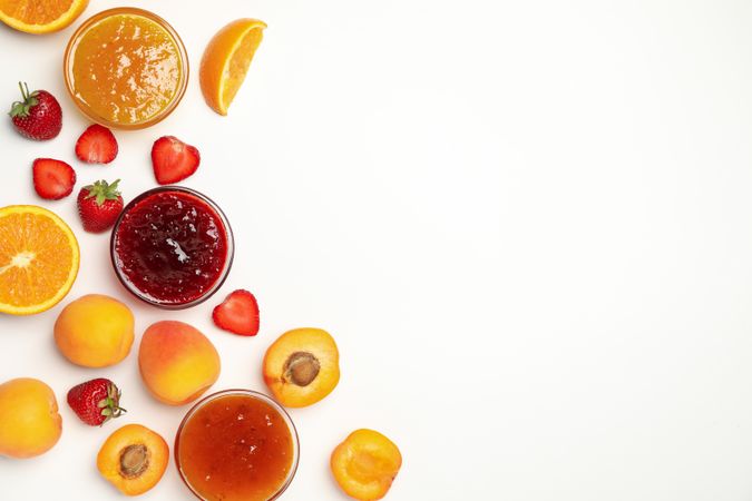 Composition with jam and ingredients on plain background, top view