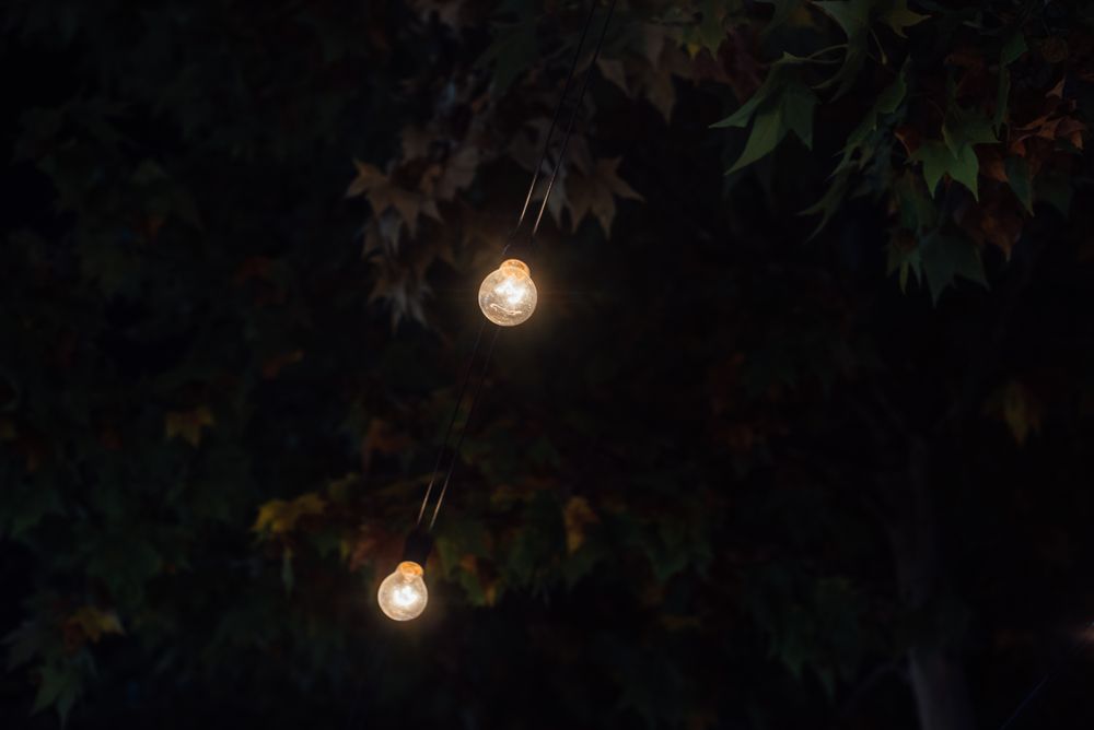 Illumination garlands on fairground at night