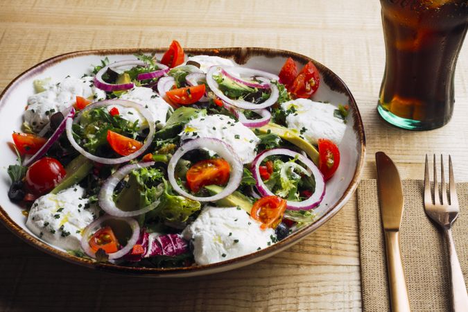 Vegetables salad with onion greens and cream sauce