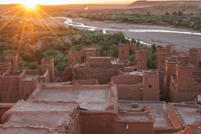 Ancient city near river in desert and wonderful sky