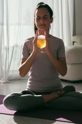 Woman meditating with beer