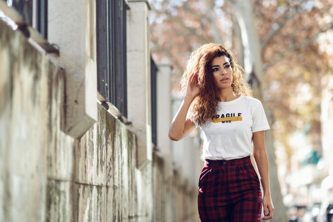 Serious Arab woman walking outside