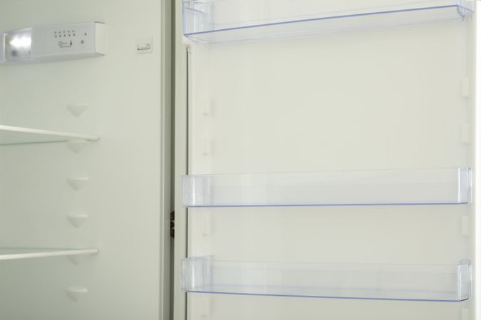 Empty shelves of empty modern fridge