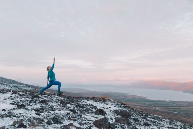 Woman posing on hill in snow