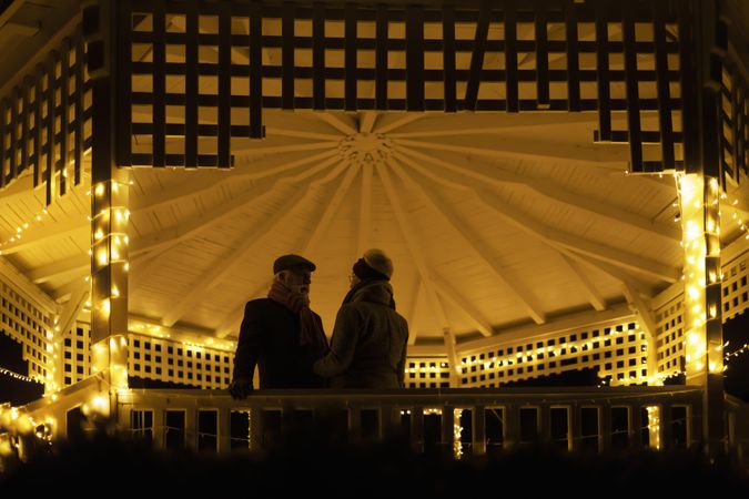Silhouette of a man and woman in a gazebo