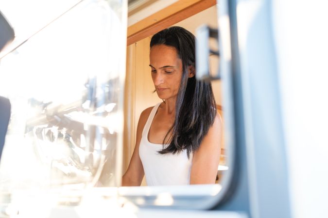 Female traveler behind trailer window