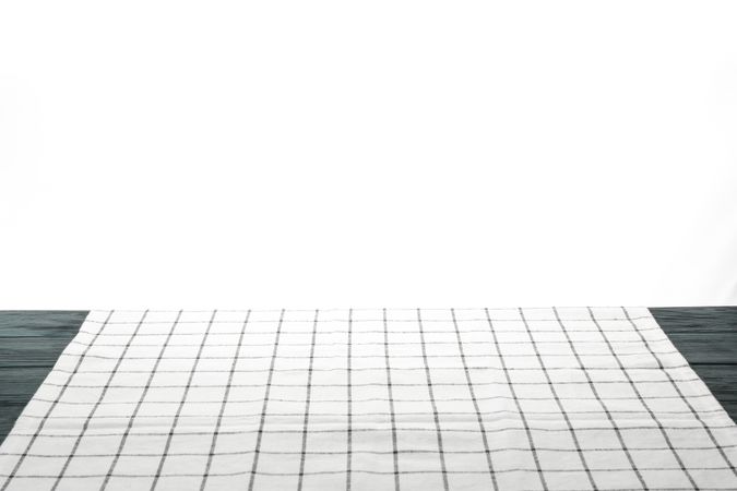 Fabric napkin on table against plain background, space for text