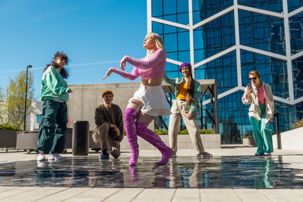 Outdoor Scene Of Young Adults Dancing Joyfully