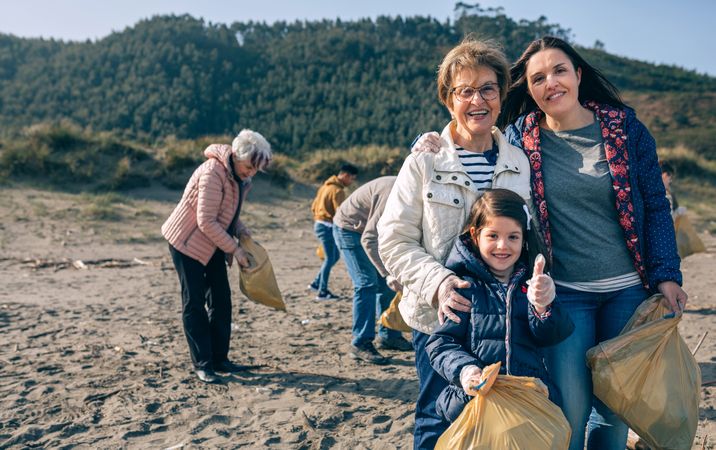 Female volunteers cleaning the beach