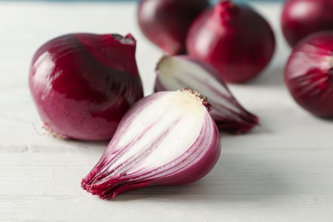 Composition with red onion on wooden background