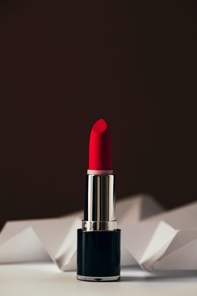 Red lipstick on raised chevron, Product and make up contemporary concept
