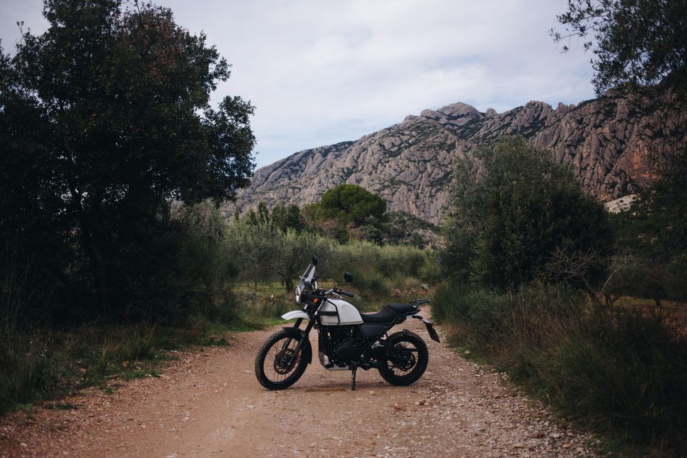 Motorcycle on remote road in the hills, landscape