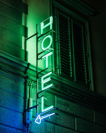 Hotel green neon signage at night