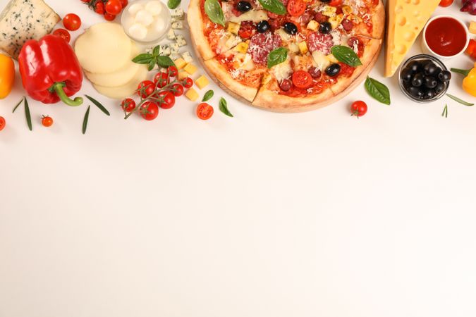 Flat lay. Pizza and ingredients: vegetables, cheese on plain background, copy space