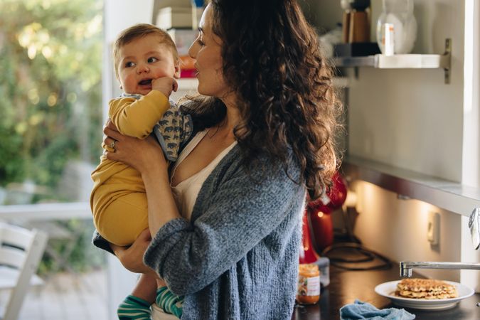 Woman on maternity leave spending quality time with baby