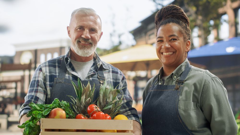 Diverse Female and Male Business Partners Posing for a Portrait, Looking at Camera and Smiling