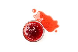Bowl with strawberry jam isolated on plain background, top view