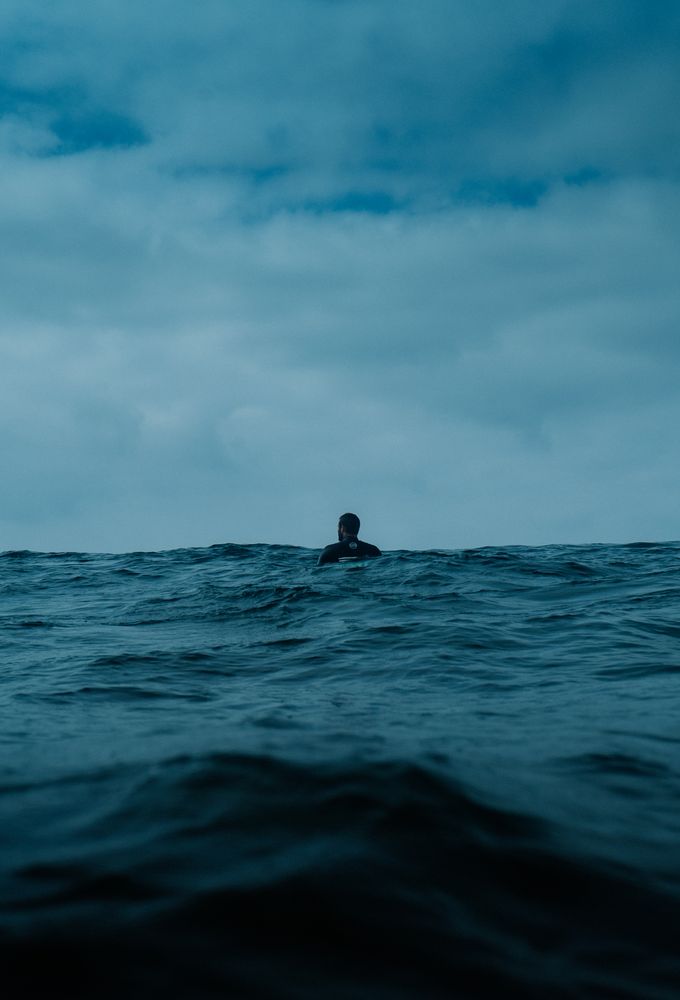 Surfer's head and shoulders in water