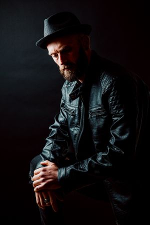 Young bearded guy in leather jacket