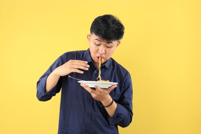 Asian Boy Eat Hot Noodles