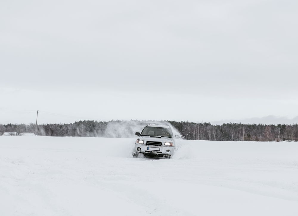Car driving on snow field