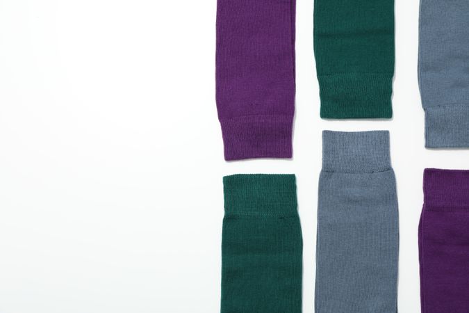 Casual clothes and wearing concept - socks, clothes for foot