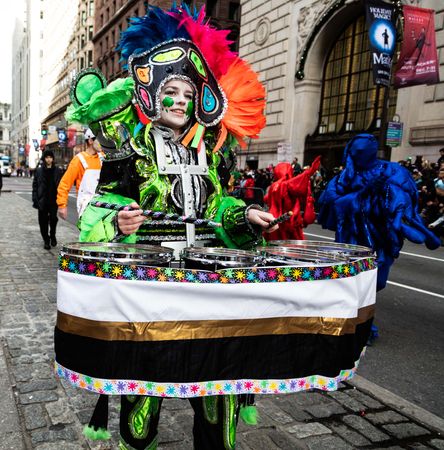 Woman playing drums in ornate costume at Mummers Parade, Philadelphia, Pennsylvania