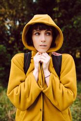 Frozen woman wrapping in coat