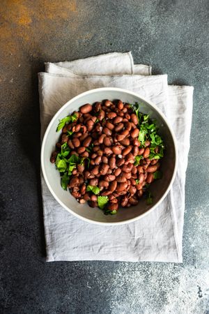 Top view of bowl of Georgian lobio dish atop napkin