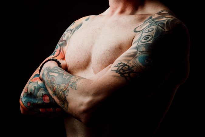 Young shirtless guy with tattoos