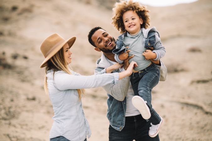 Happy multiethnic family gathering on nature