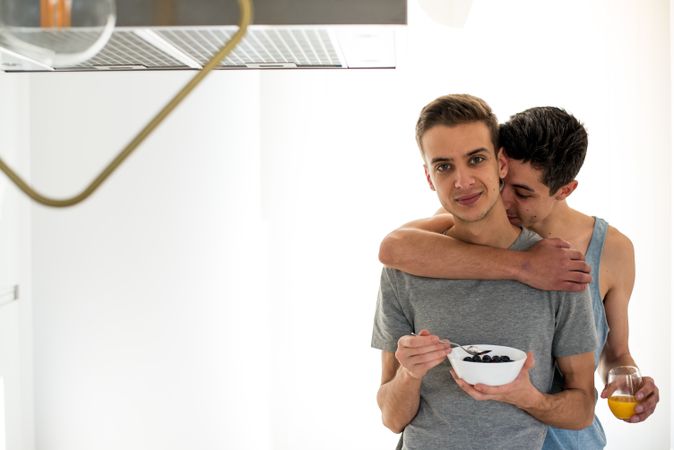 Gay couple having breakfast at home
