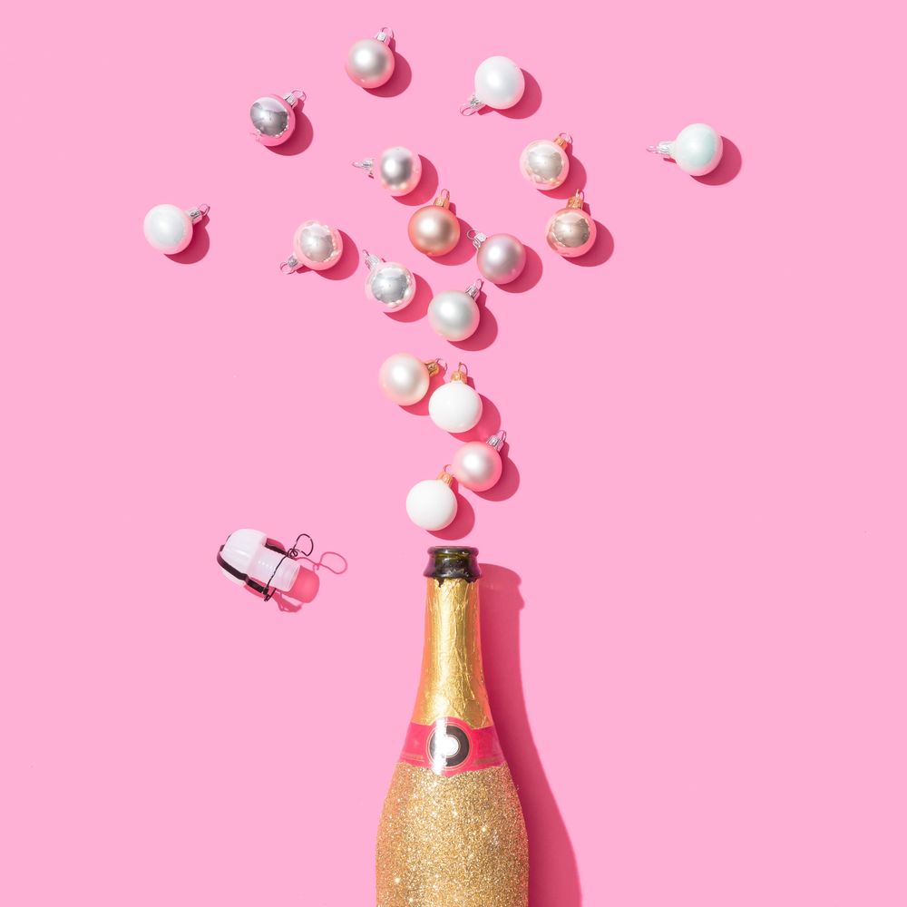Golden champagne bottle with pearl and silver baubles